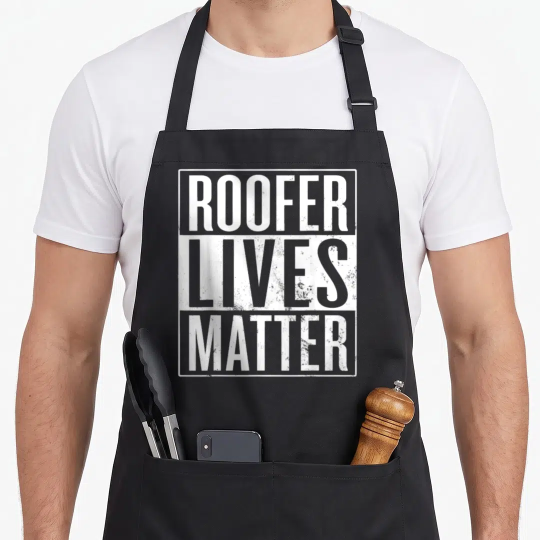 Matter roofing apron - ROOFER LIVES MATTER text in distressed white font inside a rectangular border — shown on a black cotton canvas apron against a white background