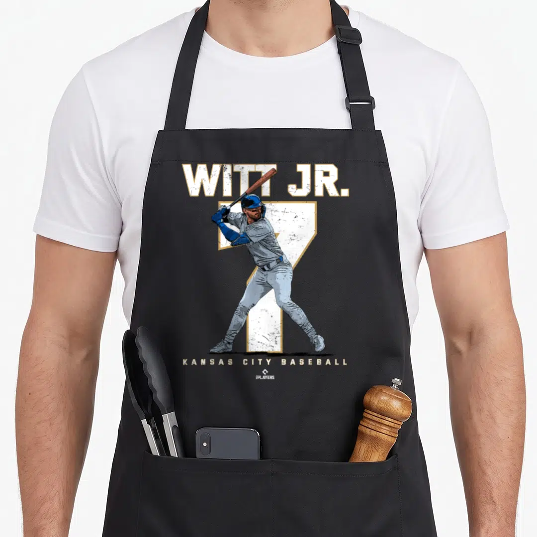 Number kansas girl apron - Distressed baseball player graphic with WITT JR. text and large number 7 in white blue — shown on a black cotton canvas apron against a white background
