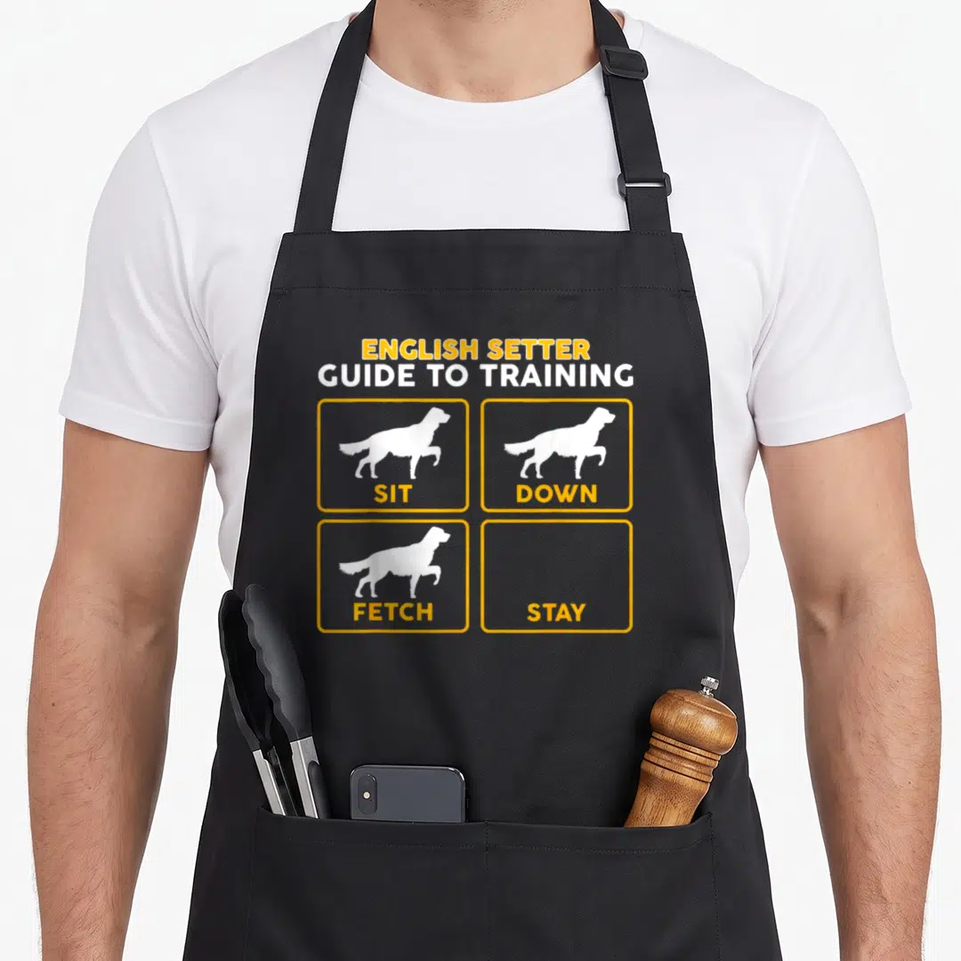 English training apron - English Setter Guide to Training with dog silhouettes for Sit Down Fetch and empty Stay box — shown on a black cotton canvas apron against a white background