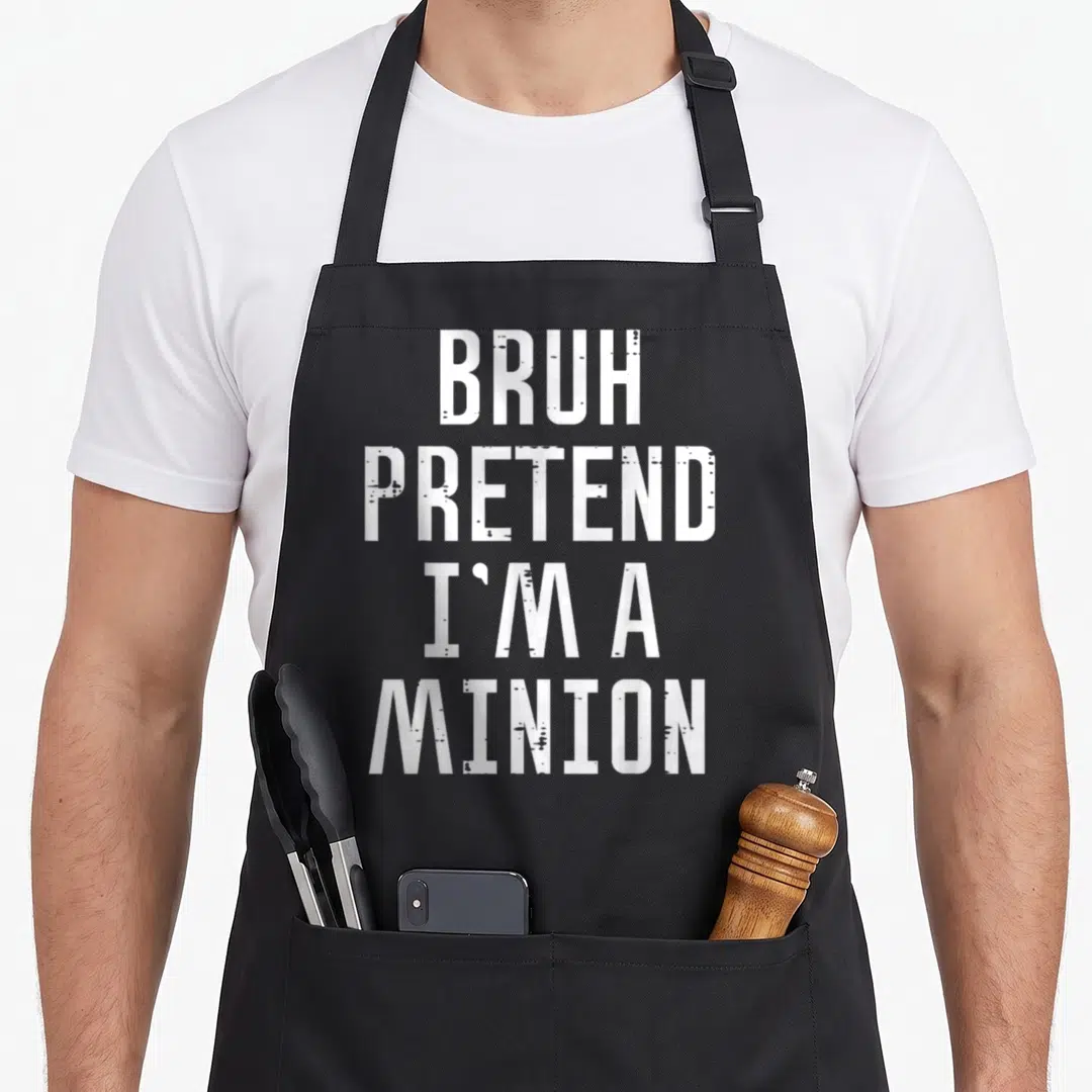 Bruh pretend halloween apron - White stacked text reading BRUH PRETEND I'M A MINION on grey background — shown on a black cotton canvas apron against a white background