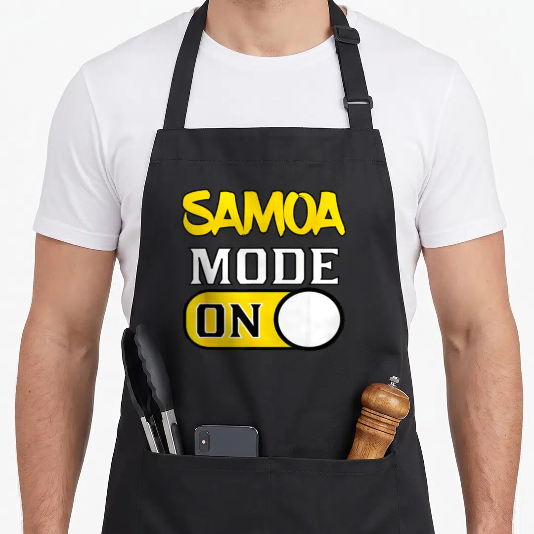 Funny samoan samoa apron - Vertical SAMOA MODE ON text above yellow toggle switch graphic — shown on a black cotton canvas apron against a white background