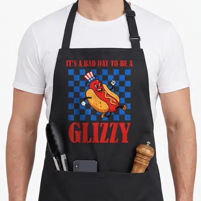 Glizzy 4th of july apron - Running cartoon hot dog in top hat on blue grey checkerboard with red text — shown on a black cotton canvas apron against a white background