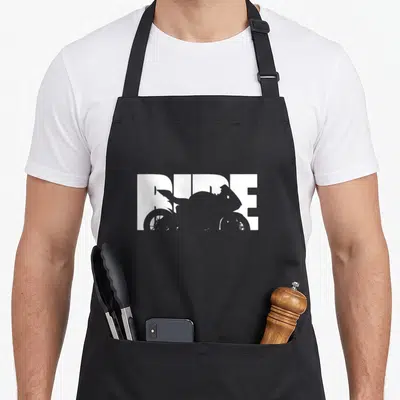 Bike motorcycle apron - White RIDE text with grey motorcycle silhouette cutout on black bib apron — shown on a black cotton canvas apron against a white background