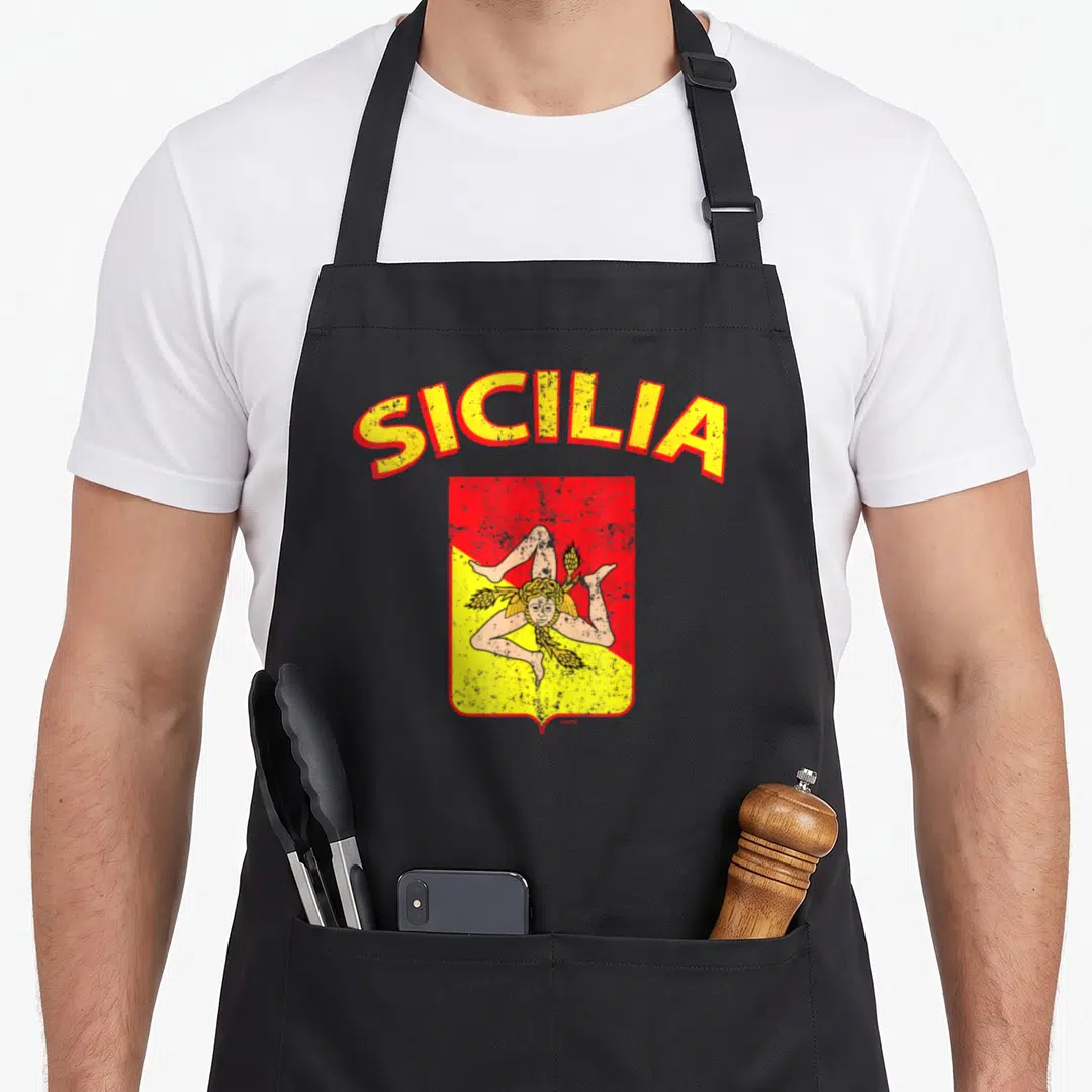 Italia sicily apron - Retro triskelion shield with arched SICILIA text in yellow and red — shown on a black cotton canvas apron against a white background