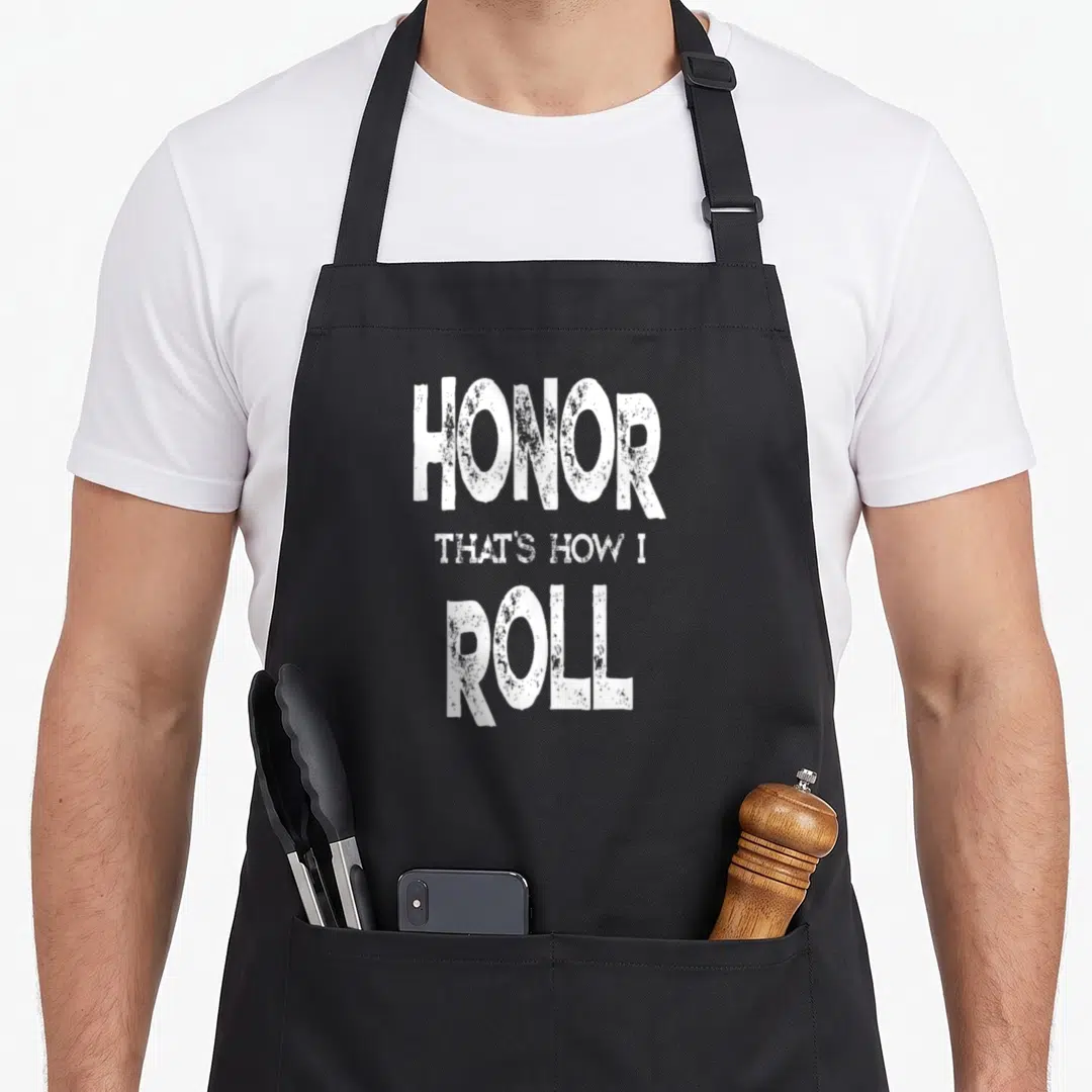 Honor student aprons - White stacked text HONOR THAT'S HOW I ROLL with distressed texture — shown on a black cotton canvas apron against a white background