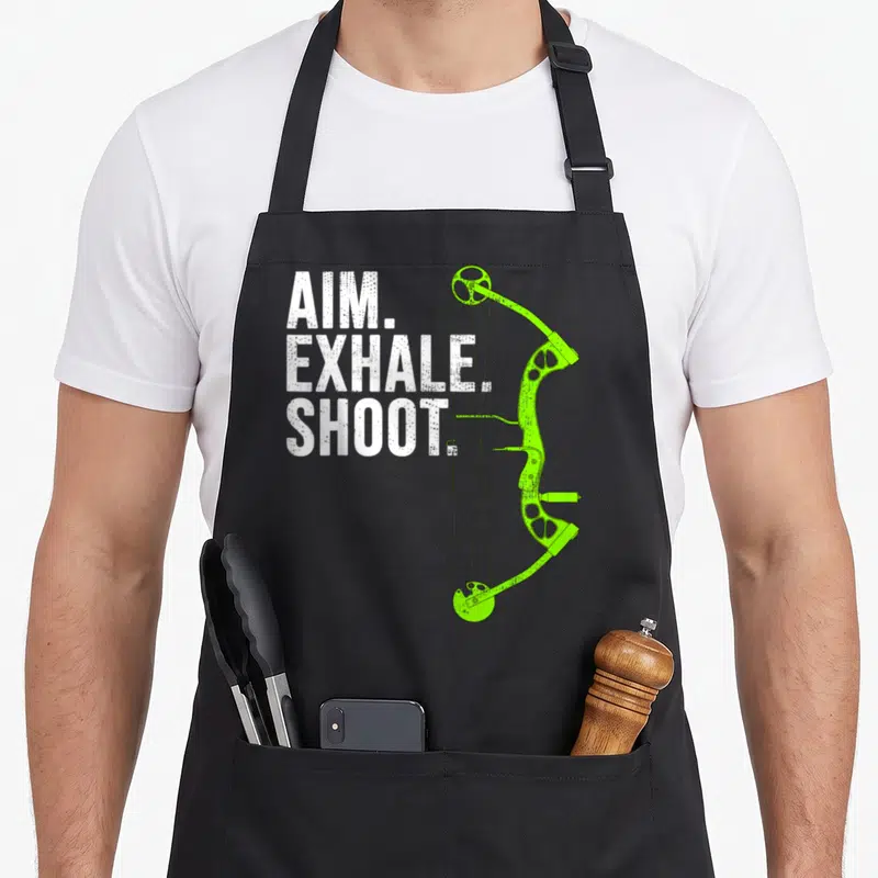 Aim bow apron - White stacked text next to lime green compound bow illustration — shown on a black cotton canvas apron against a white background