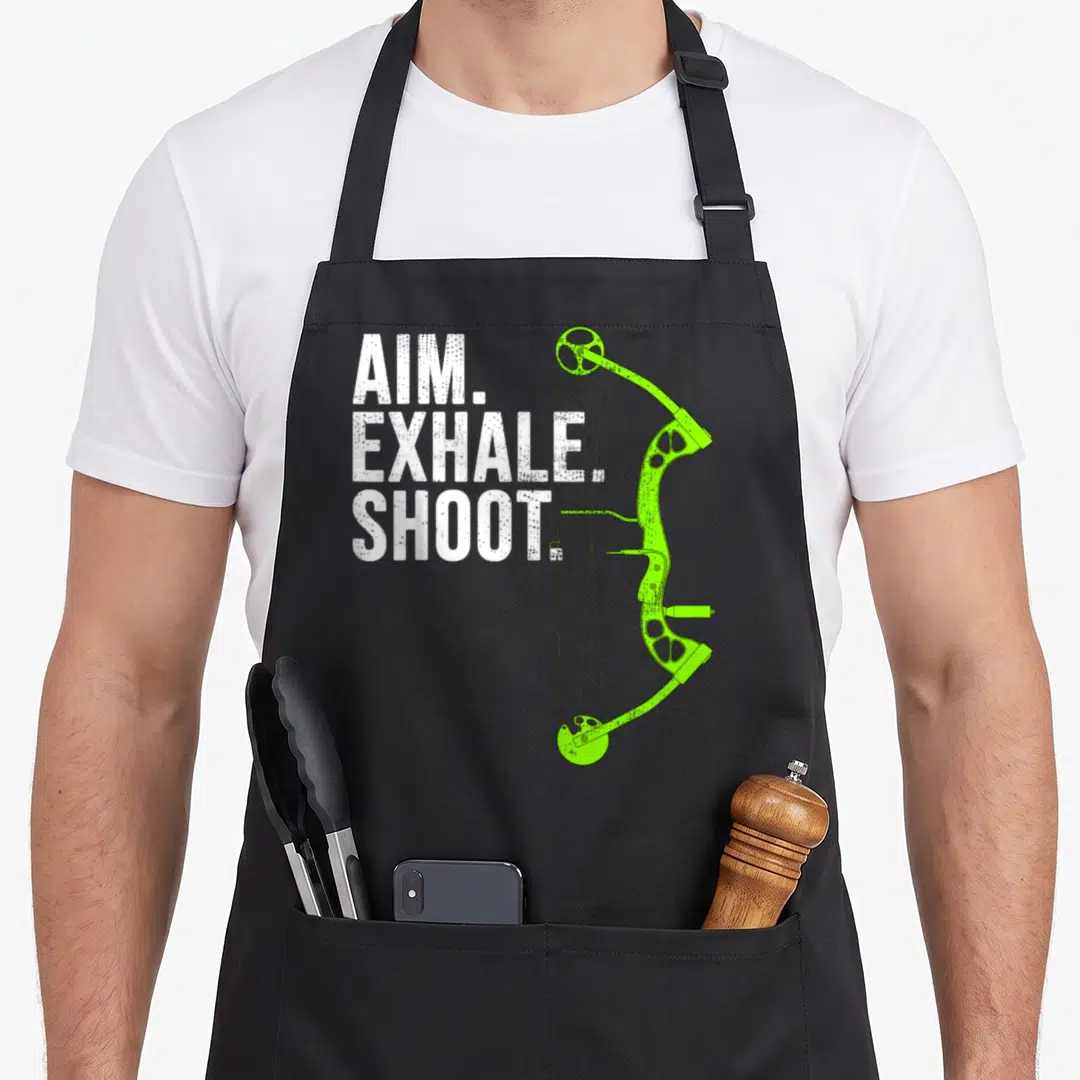 Aim bow apron - White stacked text next to lime green compound bow illustration — shown on a black cotton canvas apron against a white background