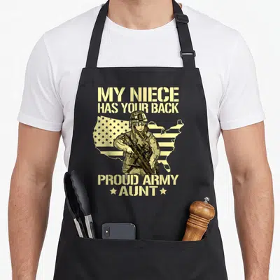 Niece military apron - Soldier holding rifle over US map with My Niece Has Your Back text — shown on a black cotton canvas apron against a white background