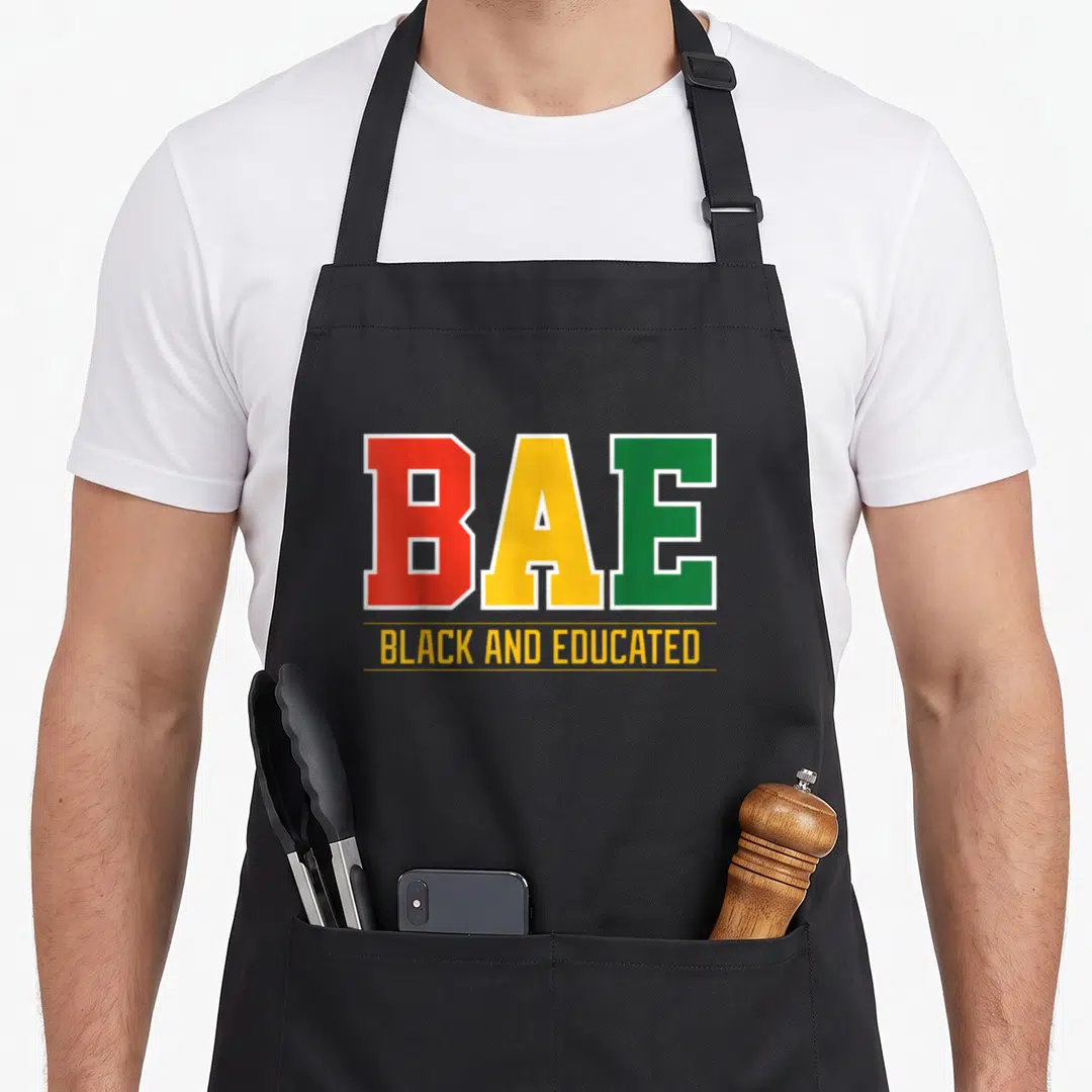 University college apron - BAE in red yellow and green block letters above BLACK AND EDUCATED in yellow between two — shown on a black cotton canvas apron against a white background