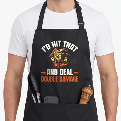 Rpg role playing gaming apron - Flaming d20 die with text I'D HIT THAT AND DEAL DOUBLE DAMAGE in white and orange — shown on a black cotton canvas apron against a white background