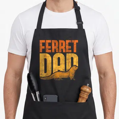 Ferret zoo animal apron - Stacked orange and yellow FERRET DAD text with a ferret silhouette across the bottom — shown on a black cotton canvas apron against a white background