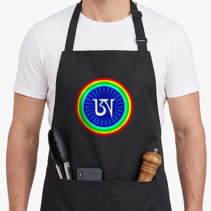 Tibetan colorful aprons - White Om symbol inside blue petals surrounded by red yellow green and light blue concentric — shown on a black cotton canvas apron against a white background