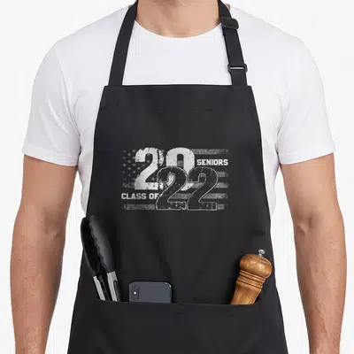 Class distressed american flag apron - White distressed 2022 seniors class of flag print on black apron — shown on a black cotton canvas apron against a white background
