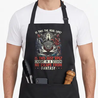 Gamer master apron - d20 die surrounded by red dragon and blue-grey castle with fantasy quote text — shown on a black cotton canvas apron against a white background