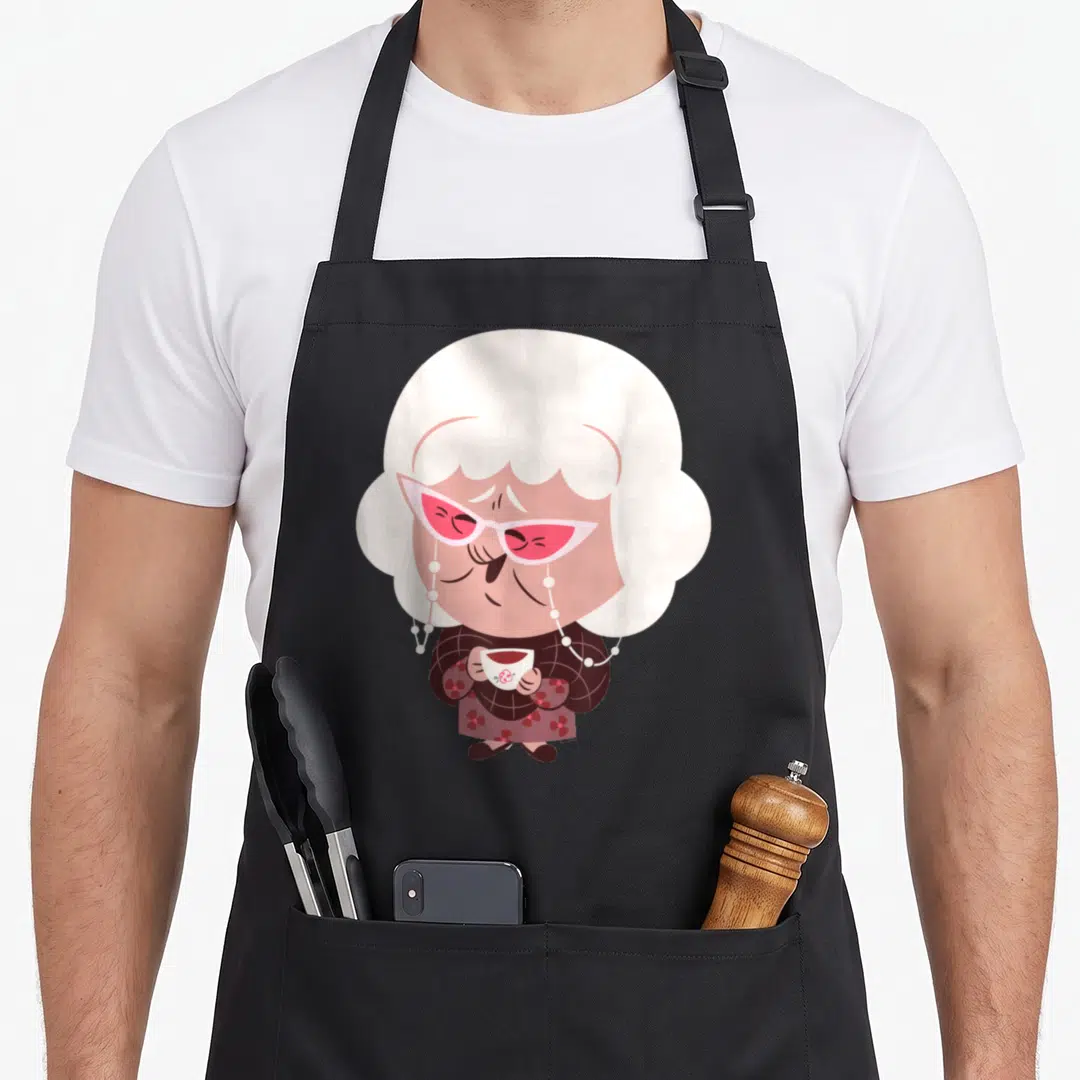 Emotion face apron - Cartoon elderly woman with pink glasses and teacup in white pink brown — shown on a black cotton canvas apron against a white background