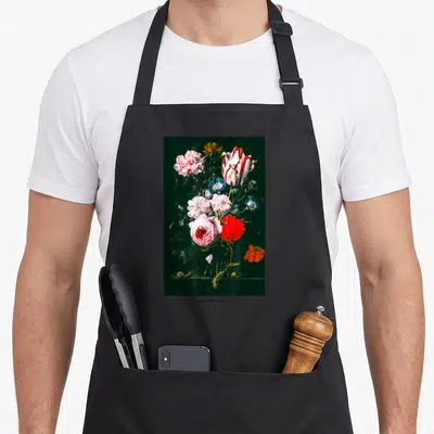 Rose streetwear apron - Vertical floral bouquet with snail and wheat stalk on dark background — shown on a black cotton canvas apron against a white background