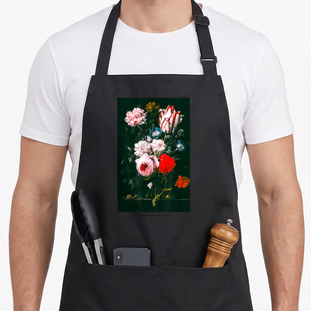 Rose streetwear apron - Vertical floral bouquet with snail and wheat stalk on dark background — shown on a black cotton canvas apron against a white background