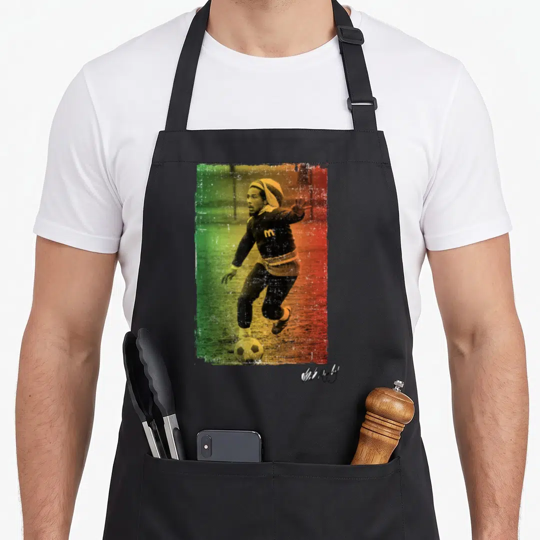 Bob football apron - Soccer player photo with green yellow red distressed gradient and signature — shown on a black cotton canvas apron against a white background
