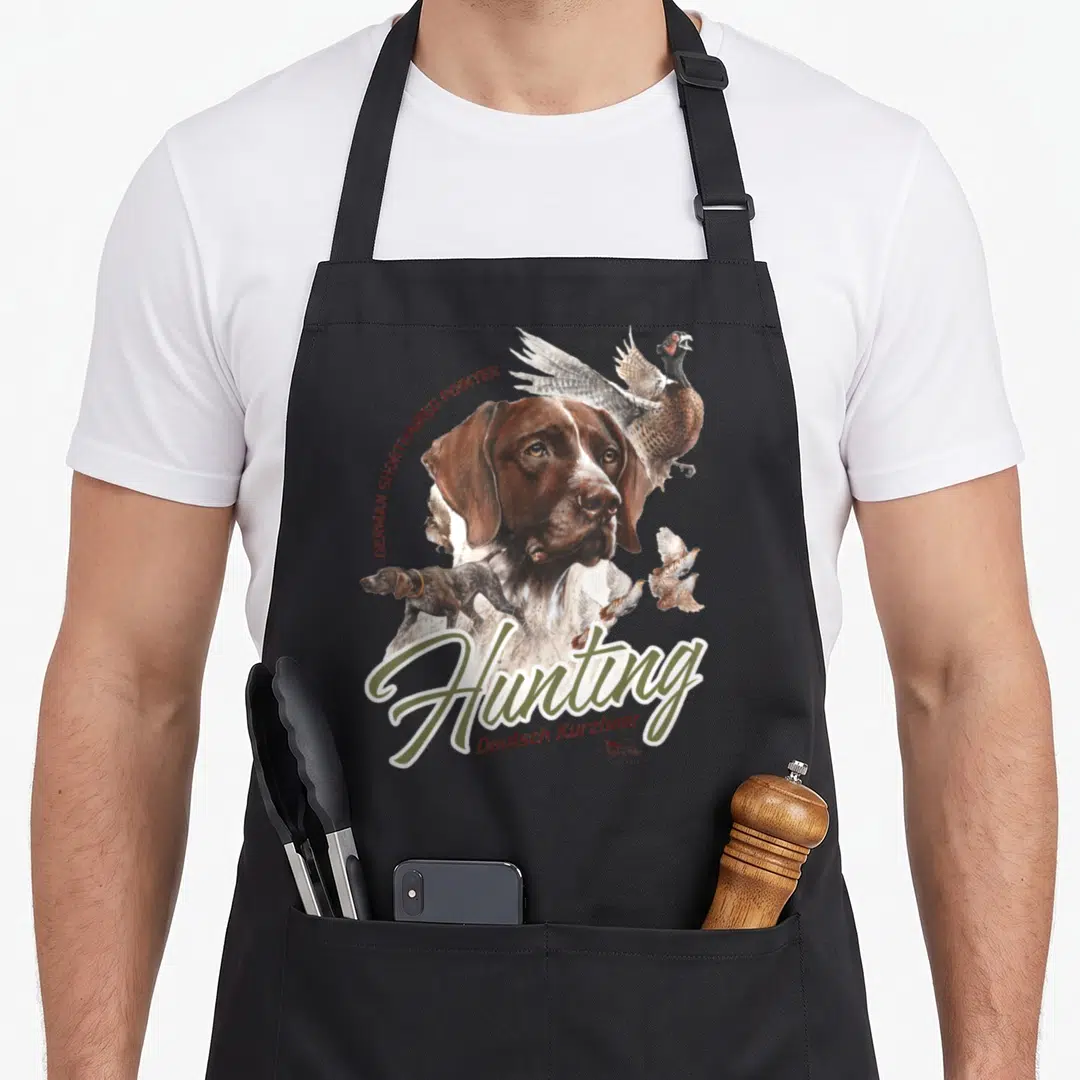 Shorthaired pointer dog apron - Realistic German Shorthaired Pointer head, pheasant, quail, and Hunting text in olive — shown on a black cotton canvas apron against a white background