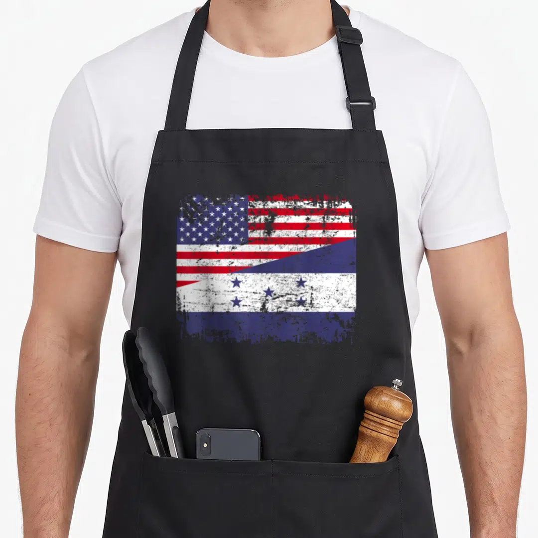 Honduran american flag apron - Distressed USA and Honduras flags split diagonally in red white and blue — shown on a black cotton canvas apron against a white background