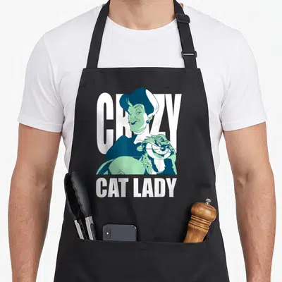 Cinderella crazy cat lady apron - Cartoon woman holding a cat with CRAZY CAT LADY text in teal and white — shown on a black cotton canvas apron against a white background