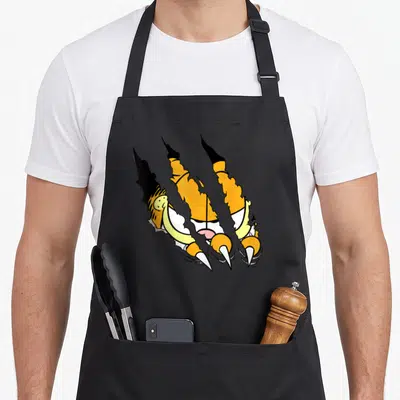 Claw general apron - Three diagonal claw tears revealing tiger face and fur in yellow black white cartoon style — shown on a black cotton canvas apron against a white background