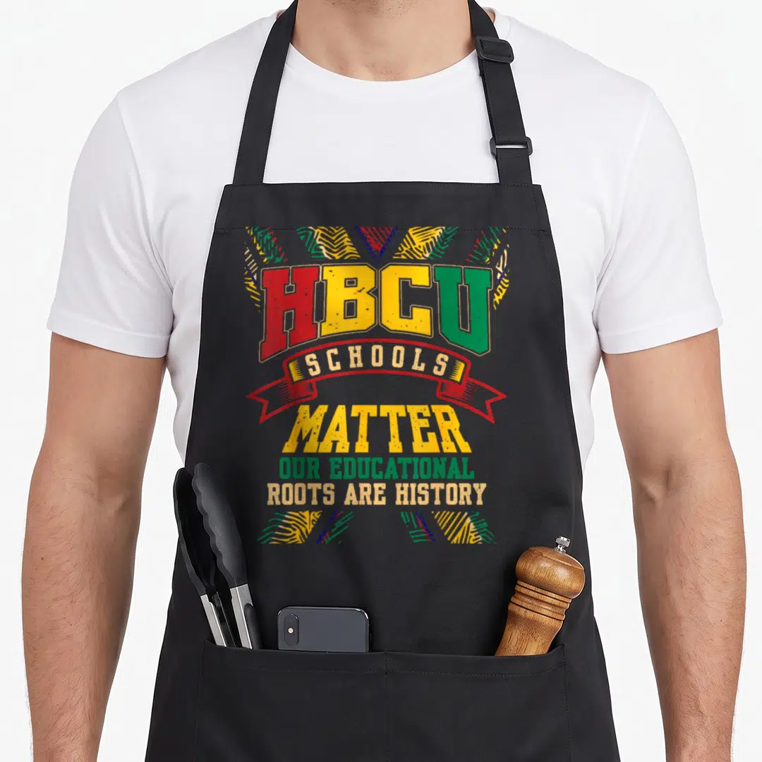 Hbcu african american aprons - HBCU SCHOOLS MATTER OUR EDUCATIONAL ROOTS ARE HISTORY red yellow green blue striped — shown on a black cotton canvas apron against a white background