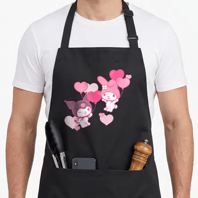 Funny valentine's day apron - My Melody and Kuromi holding pink heart balloons in cartoon style with purple and white — shown on a black cotton canvas apron against a white background