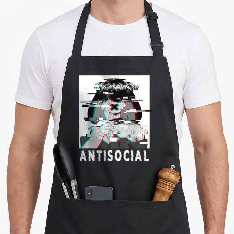 Glitch anime apron - Pixel art girl with red cross eyes and glitchy white ANTISOCIAL text — shown on a black cotton canvas apron against a white background
