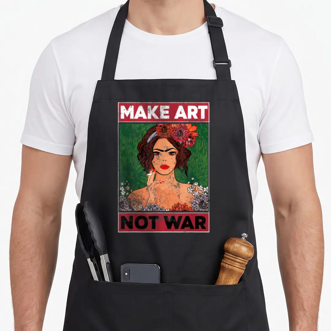 War painter apron - Retro poster of a woman with flowers and red banners reading MAKE ART NOT WAR — shown on a black cotton canvas apron against a white background