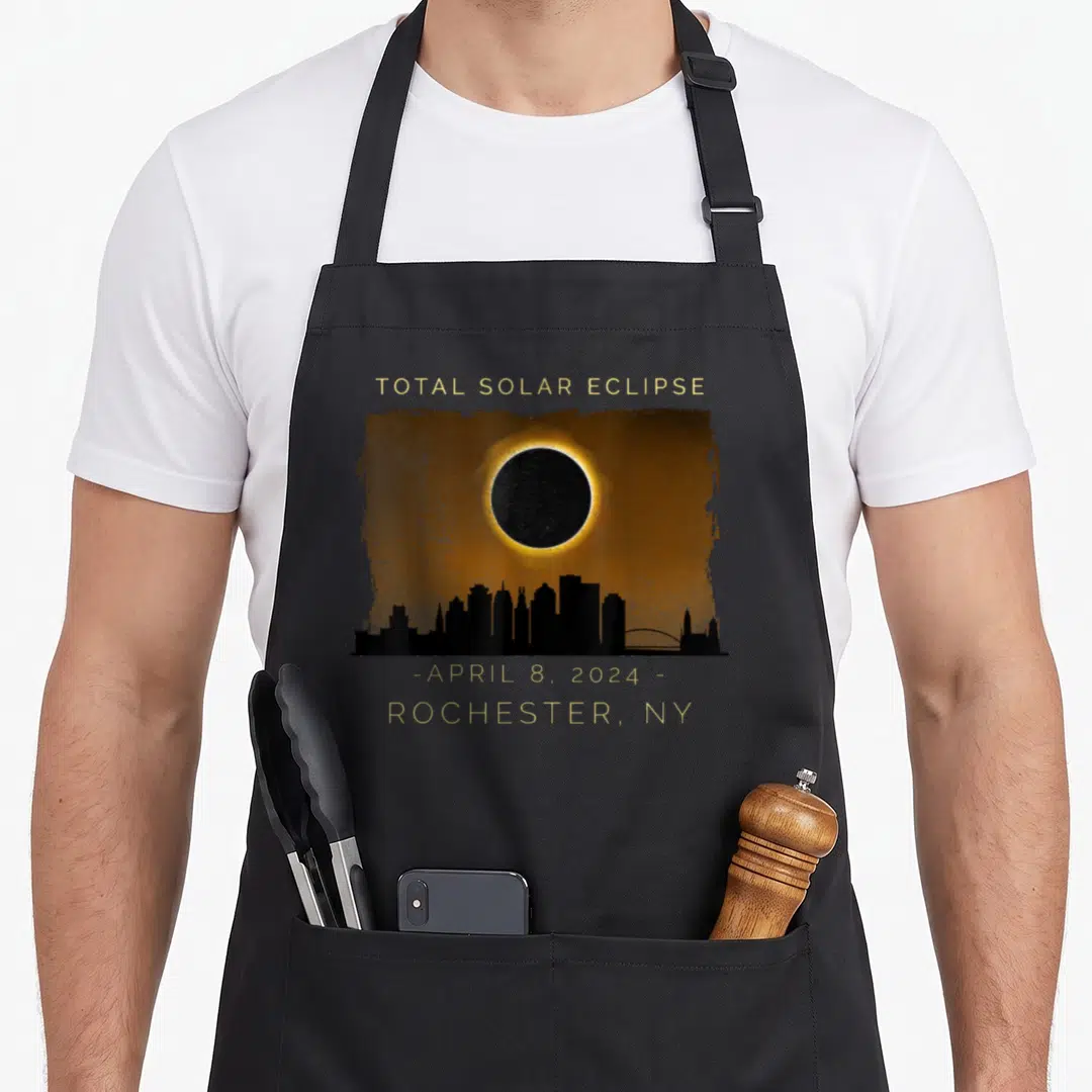 Total solar new york apron - Total Solar Eclipse April 8 2024 Rochester NY skyline gold black orange art — shown on a black cotton canvas apron against a white background