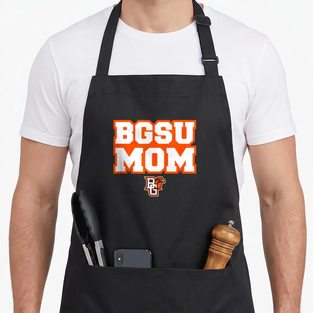 Funny bowling falcon apron - BGSU MOM text in white with orange borders above a small BGSU falcon logo — shown on a black cotton canvas apron against a white background