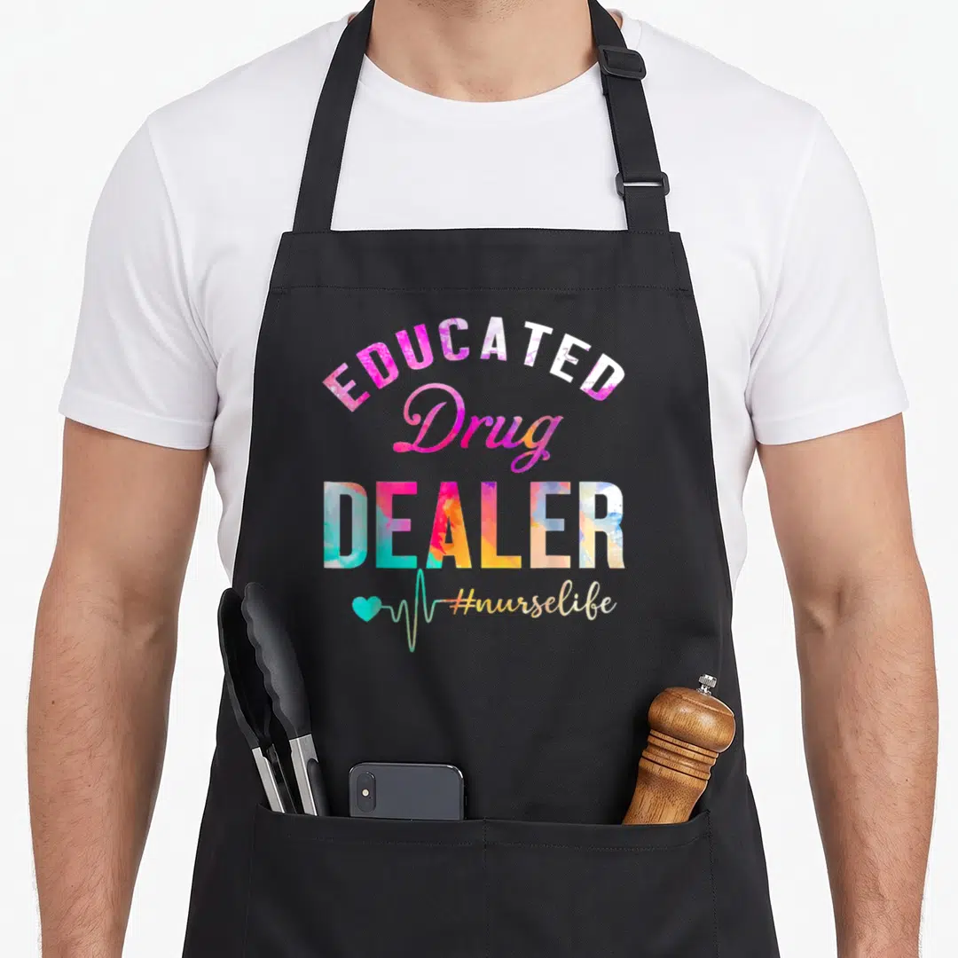 Educated drug nurse apron - Stacked colorful text reading Educated Drug Dealer with a teal heartbeat line — shown on a black cotton canvas apron against a white background