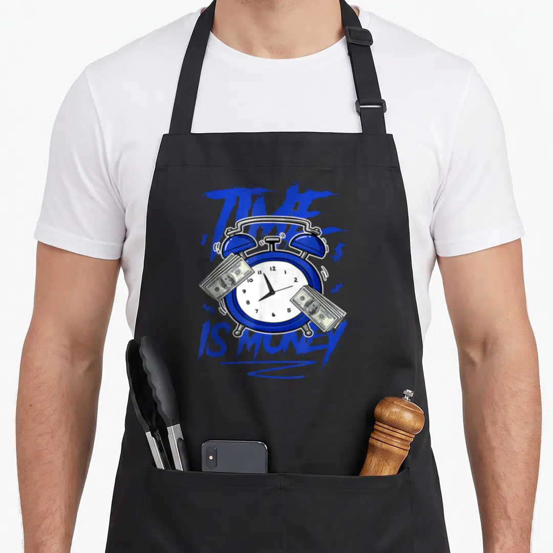 Racer money apron - Blue alarm clock with dollar bills and blue paint splatters surrounding TIME IS MONEY text — shown on a black cotton canvas apron against a white background