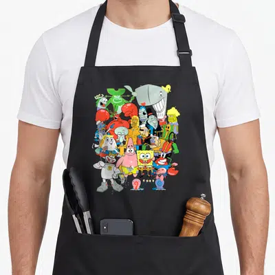 Squarepant character aprons - Vertical cartoon cluster of SpongeBob, Patrick, Mr Krabs, and crew in yellow pink red blue — shown on a black cotton canvas apron against a white background