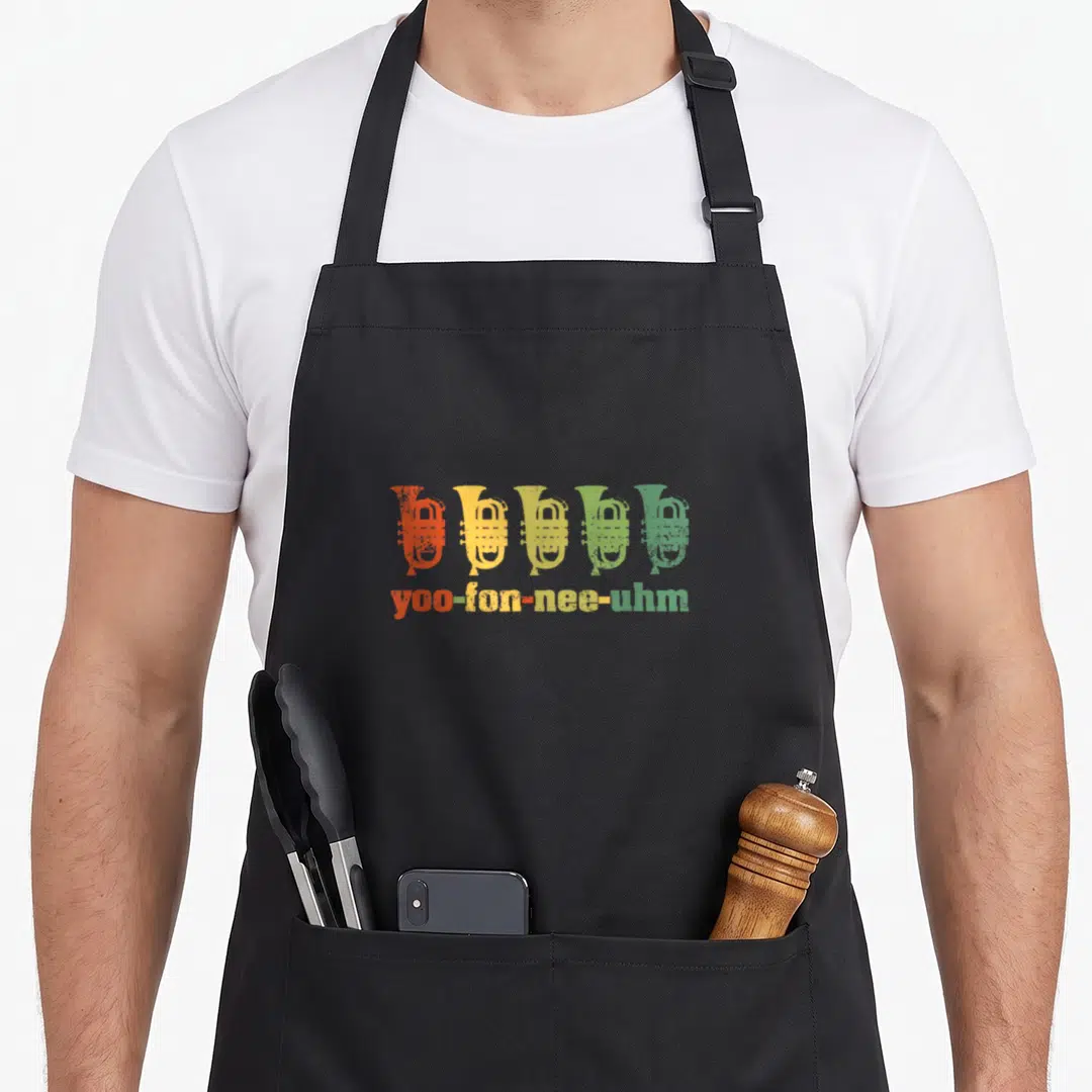 Euphonium horn apron - Five french horns in orange yellow and green gradient above phonetic text yoo-fon-nee-uhm — shown on a black cotton canvas apron against a white background