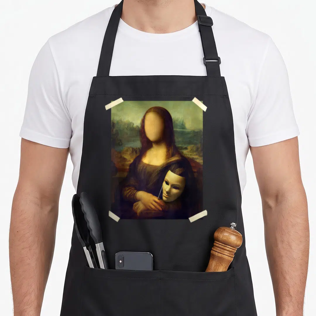 Gioconda famous aprons - Faceless woman holding white mask printed as photo taped at four corners — shown on a black cotton canvas apron against a white background