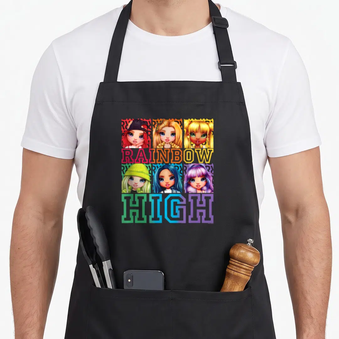 Box rainbow apron - Six doll portraits with RAINBOW HIGH text in red, yellow, green, blue, purple — shown on a black cotton canvas apron against a white background