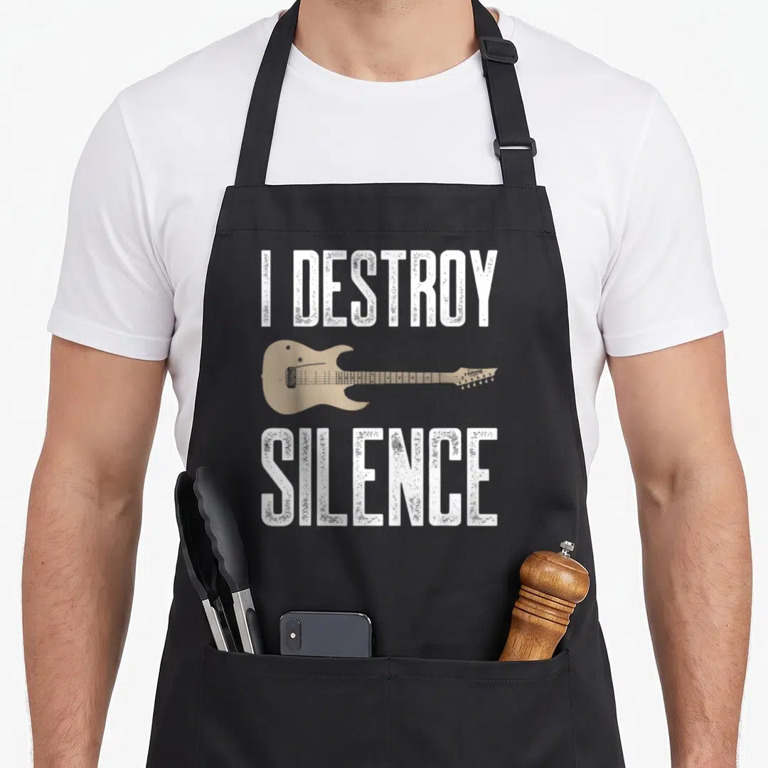 Destroy guitarist apron - Tan electric guitar between white I DESTROY SILENCE text on black apron — shown on a black cotton canvas apron against a white background