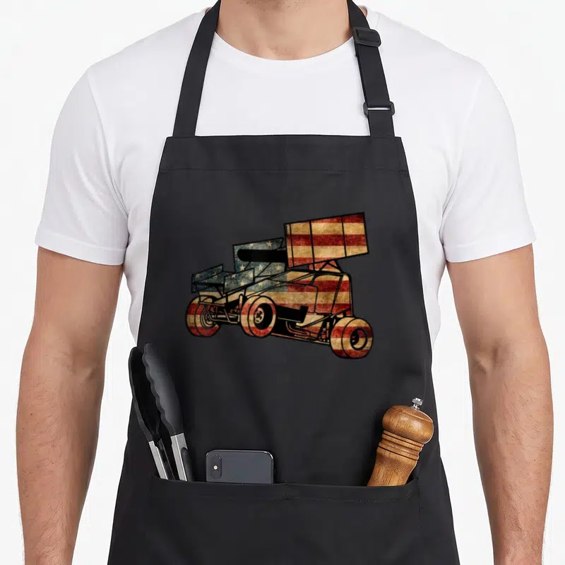 Car track apron - Sprint car graphic filled with distressed American flag pattern on black bib apron — shown on a black cotton canvas apron against a white background