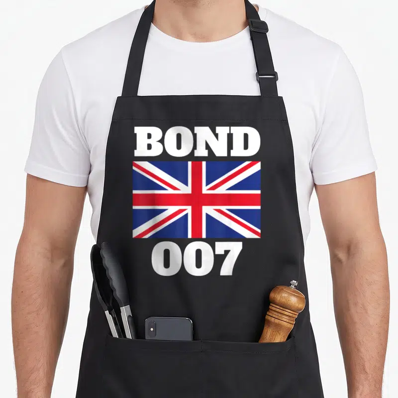 Bond union aprons - BOND 007 text framing a Union Jack flag in white red and blue — shown on a black cotton canvas apron against a white background