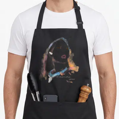 Pocahontas watercolor quotes apron - Watercolor woman portrait with orange leaves and 'I'll always be with you — shown on a black cotton canvas apron against a white background