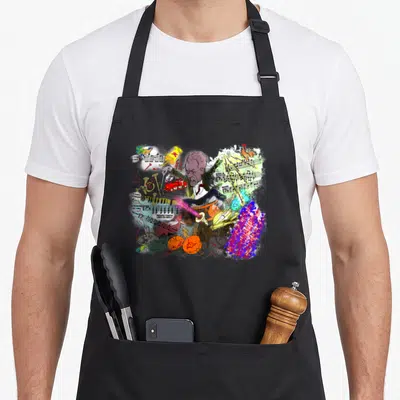 Gustav symphony apron - Cartoon conductor surrounded by FLÖTE text, rooster, train, cannon, and musical notes in red — shown on a black cotton canvas apron against a white background