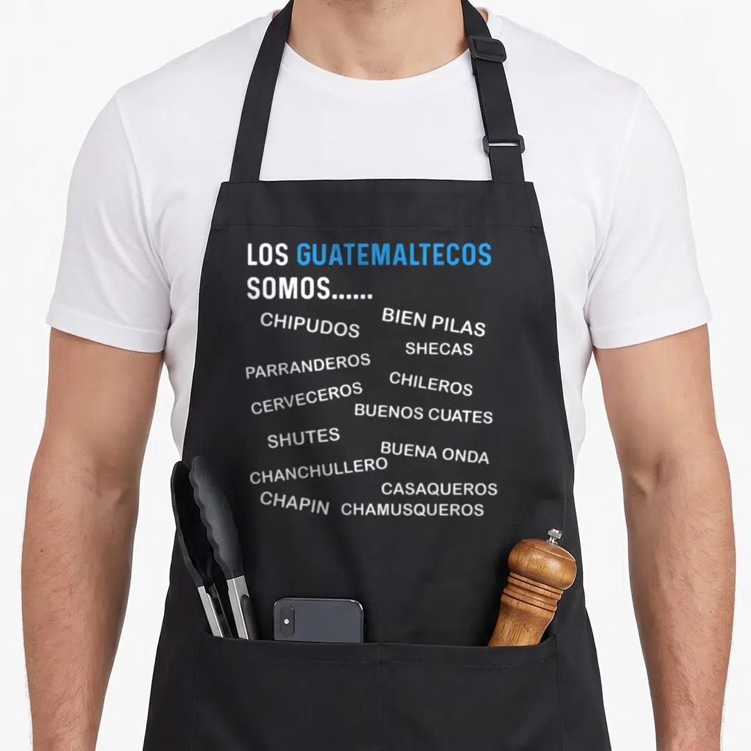 Map guatemalan aprons - White and blue Guatemalan slang words like Chipudos, Chapin, and Chileros on black fabric — shown on a black cotton canvas apron against a white background