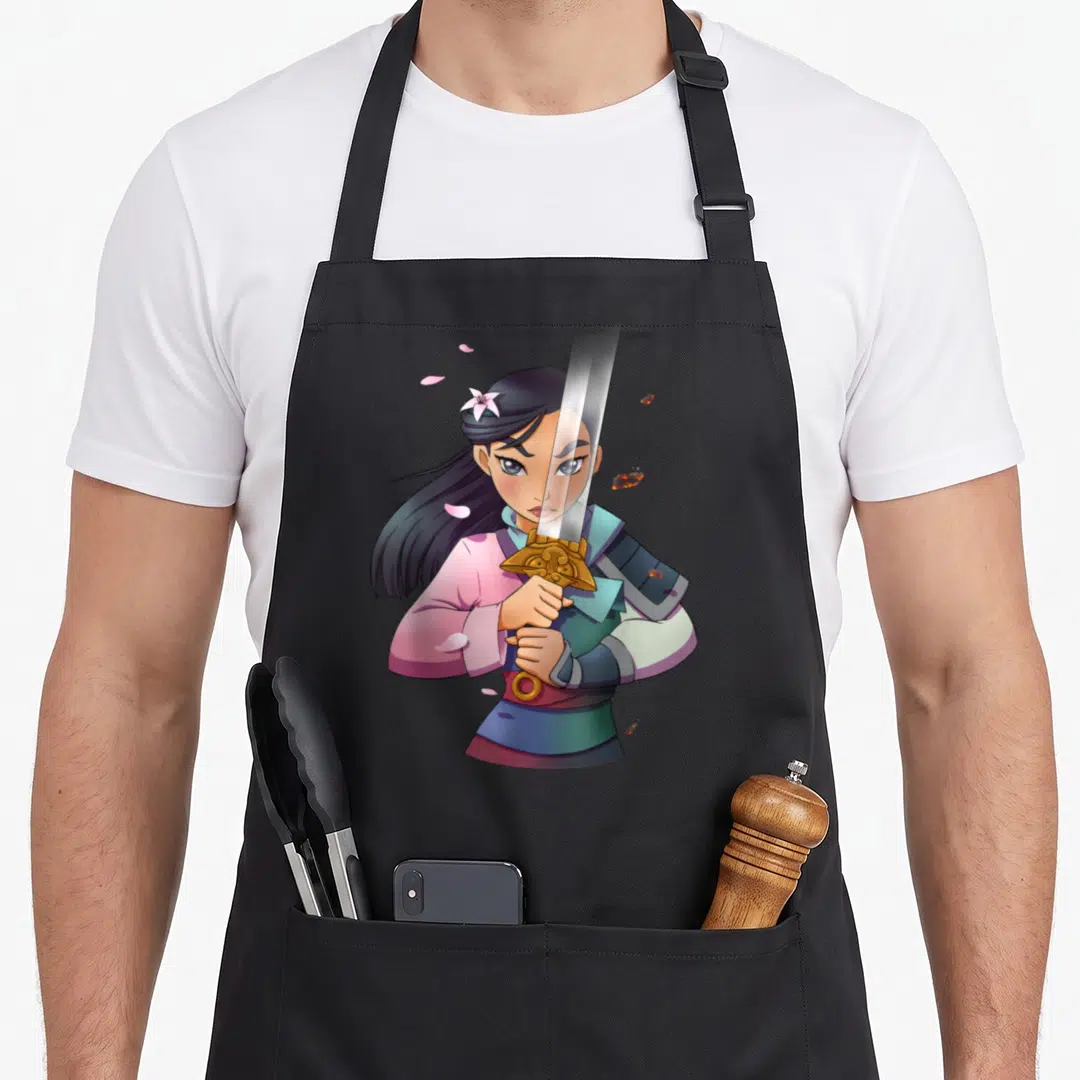 Warrior anime apron - Cartoon woman holding sword vertically in front of face with pink petals and blue armor details — shown on a black cotton canvas apron against a white background