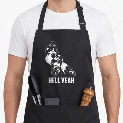 Hell wrestling apron - White line art of two wrestlers above HELL YEAH text on cotton canvas apron — shown on a black cotton canvas apron against a white background