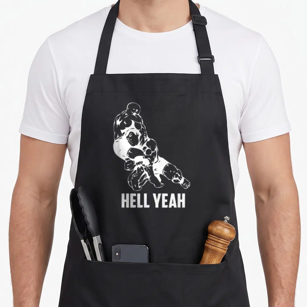 Hell wrestling apron - White line art of two wrestlers above HELL YEAH text on cotton canvas apron — shown on a black cotton canvas apron against a white background