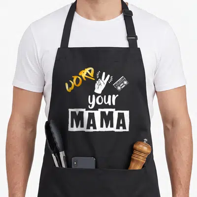 2nd hip aprons - Gold WORD text, white peace sign hand, grey boombox, distressed MAMA block — shown on a black cotton canvas apron against a white background