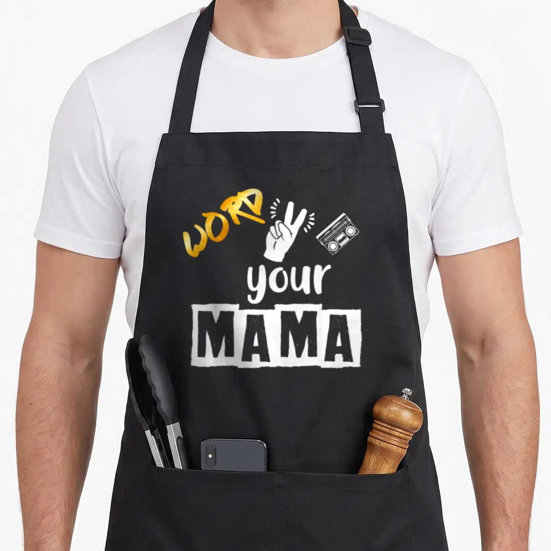 2nd hip aprons - Gold WORD text, white peace sign hand, grey boombox, distressed MAMA block — shown on a black cotton canvas apron against a white background