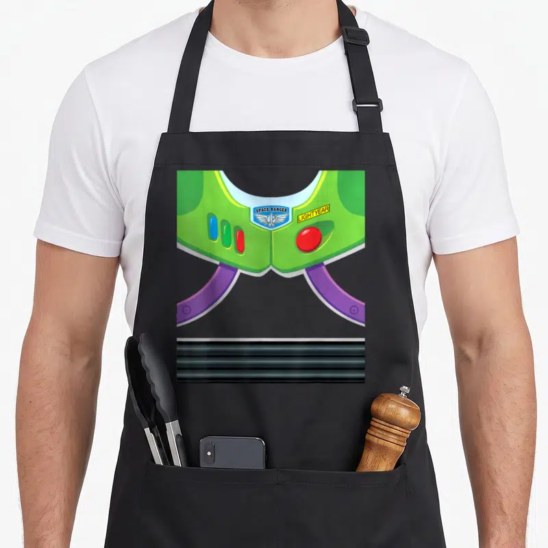 Costume camping halloween apron - Green space suit chest piece with space ranger badge and lightyear text — shown on a black cotton canvas apron against a white background